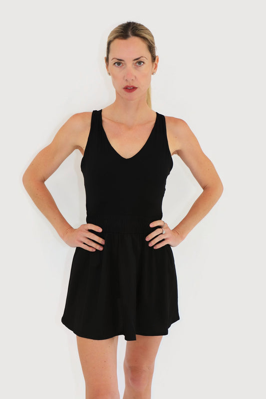 Bay Dress in Black, front view: V-neck racerback bodice with a softly smocked waist and A-line skirt