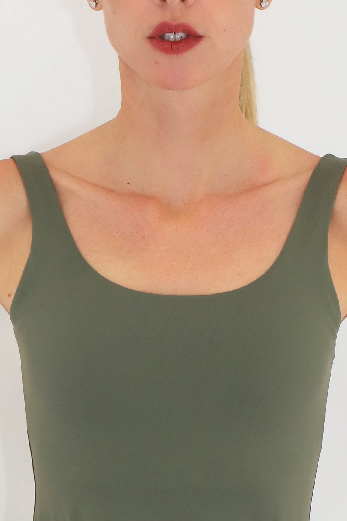 Close-up of the Court Dress scoop neckline and straps in Green