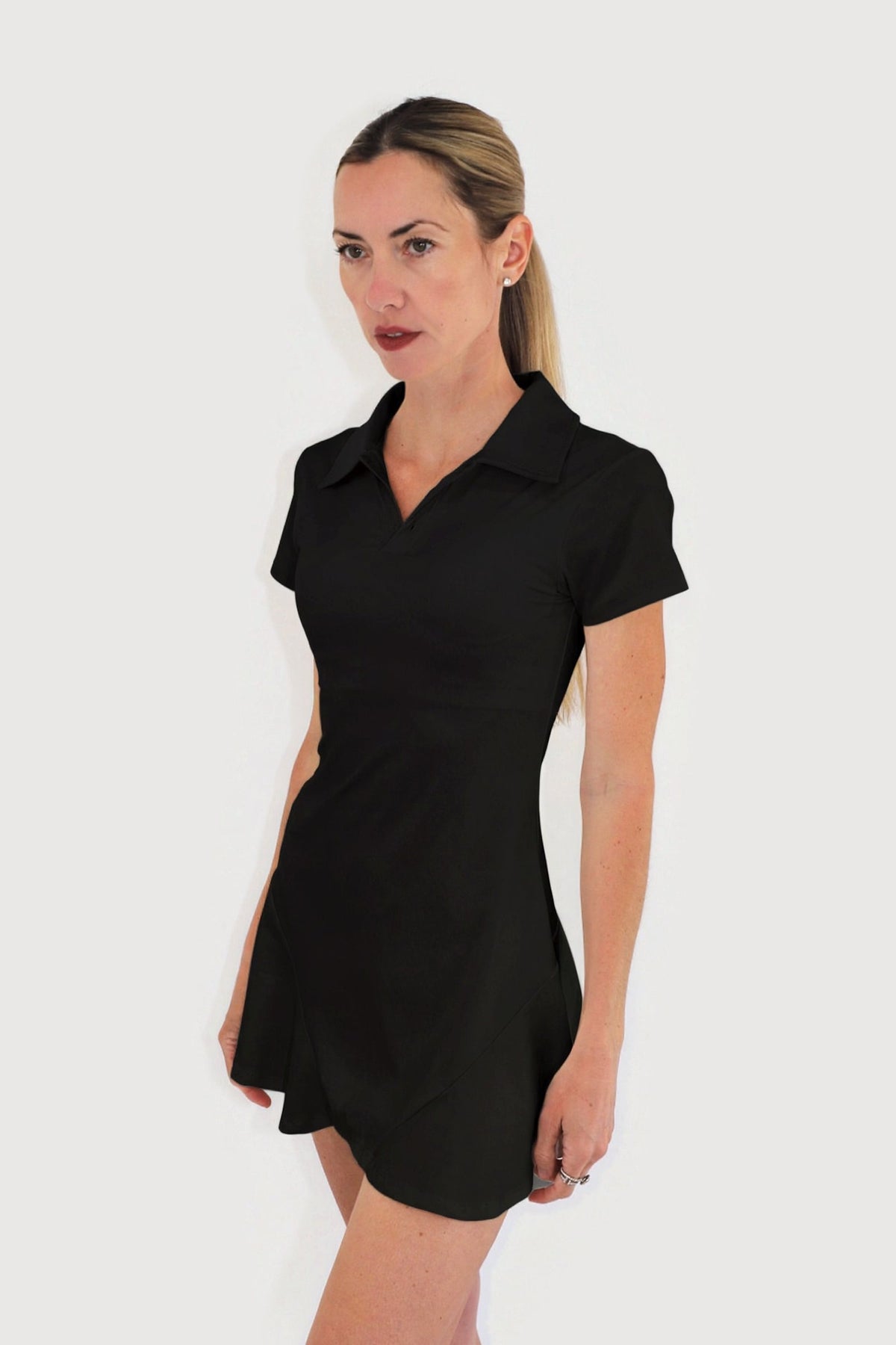 Cove Dress in Black, side view showing the skirt flare