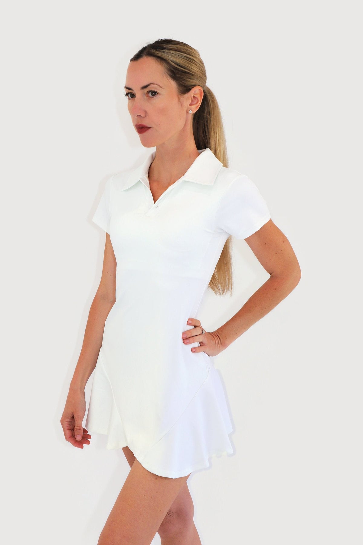 Cove Dress in White, three-quarter view showing the fitted bodice and flared skirt