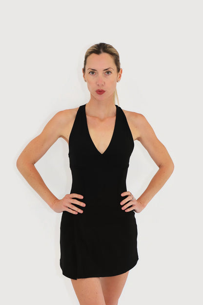 Dune Dress in Black, front view: V-neck halter bodice with contour seams and a wrap-front skirt with slit