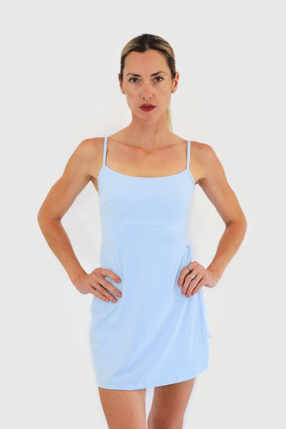 Marina Dress in Blue, front view: thin straps, scoop neckline and A-line skirt with built-in shorts