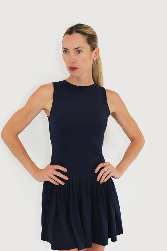 Mist Dress in Navy, front view: sleeveless high-neck bodice with a drop-waist gathered skirt and built-in shorts