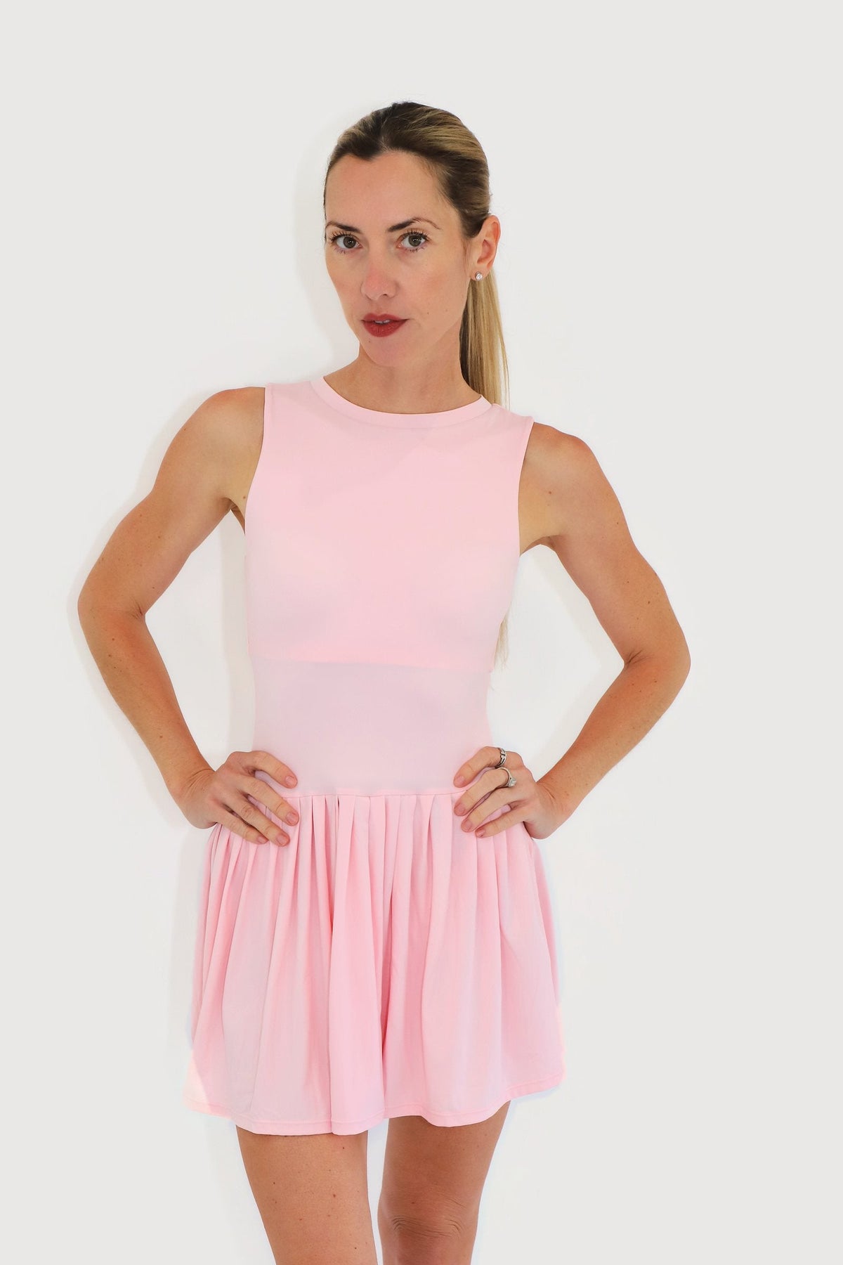Mist Dress in Pink, front view with sleeveless high-neck bodice and gathered skirt