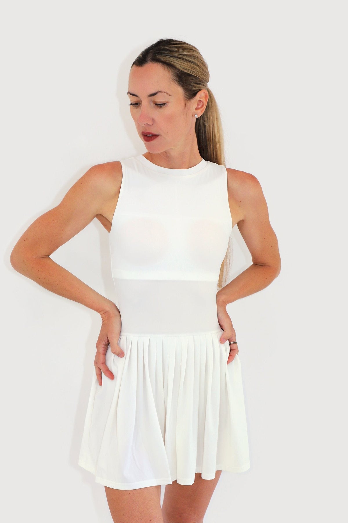 Mist Dress in White, three-quarter view showing the skirt movement