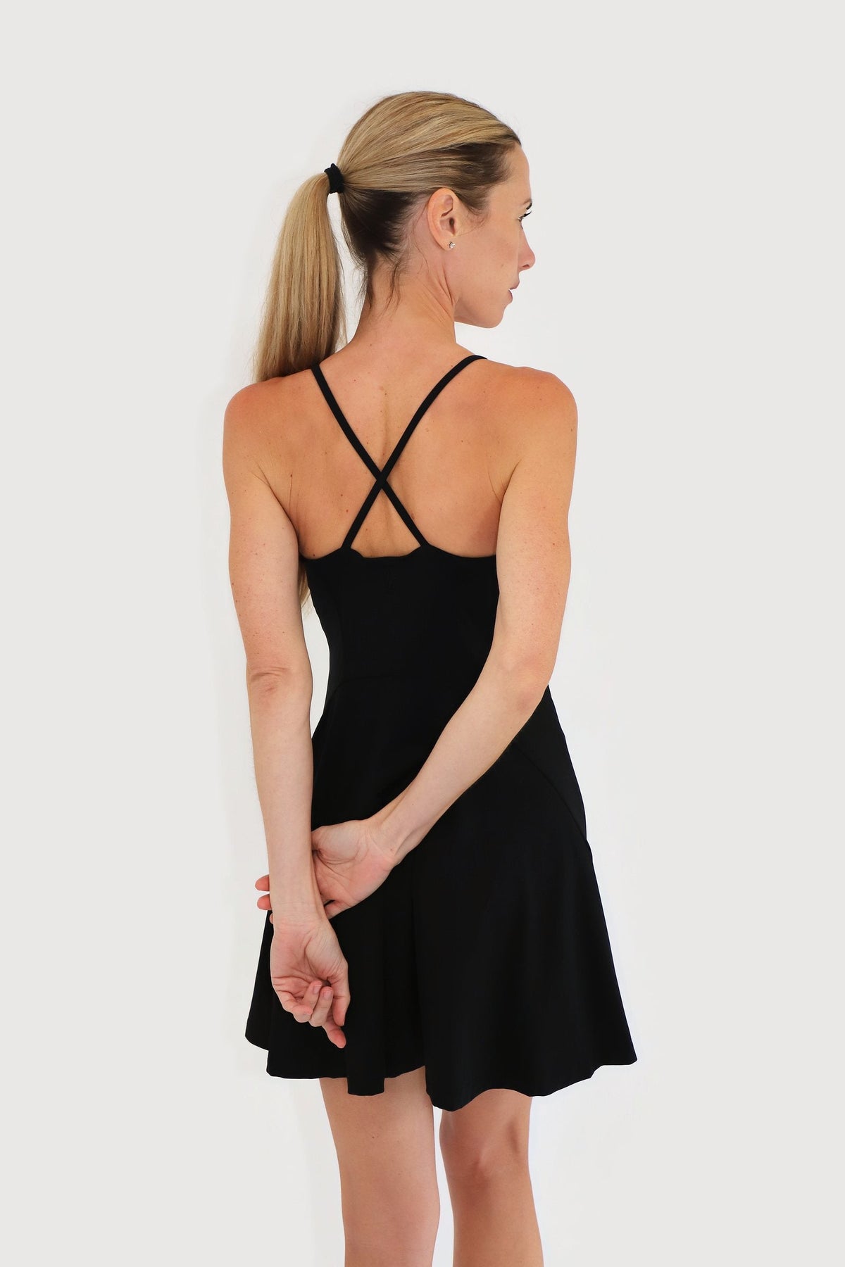Pacific Dress in Black, back view showing the cross-back straps